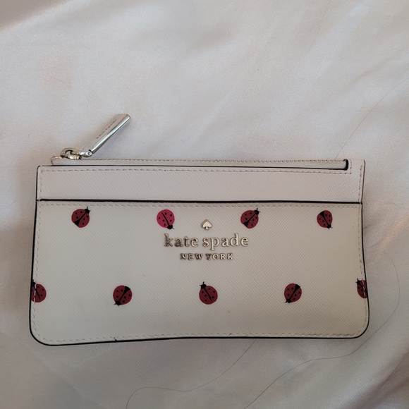 kate spade Handbags - Kate Spade White Wristlet with Ladybug Design